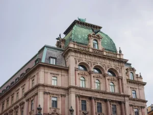 Historic building with ornate architecture and green copper roof, relevant to listed building consent and heritage restoration in London.