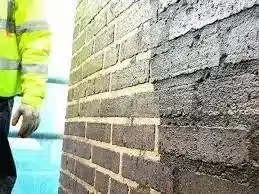 Skilled tradesperson repointing historic brickwork in London, showcasing craftsmanship and architectural detail